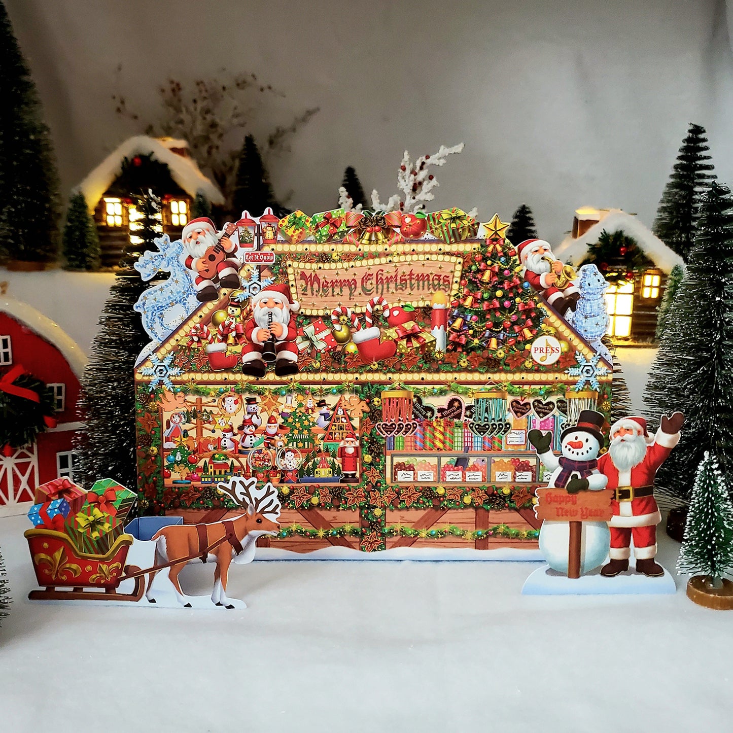 Christmas Gift Shop Pop-Up Card with 6 Melodies, LED Lights & Replaceable Battery with a gingerbread house, Santa Claus, reindeer, and snowman in a snowy landscape.