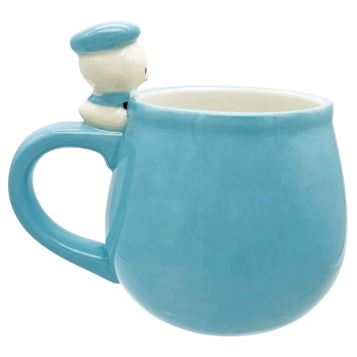 Blue mug with a small Disney Donald Duck figurine on a white background