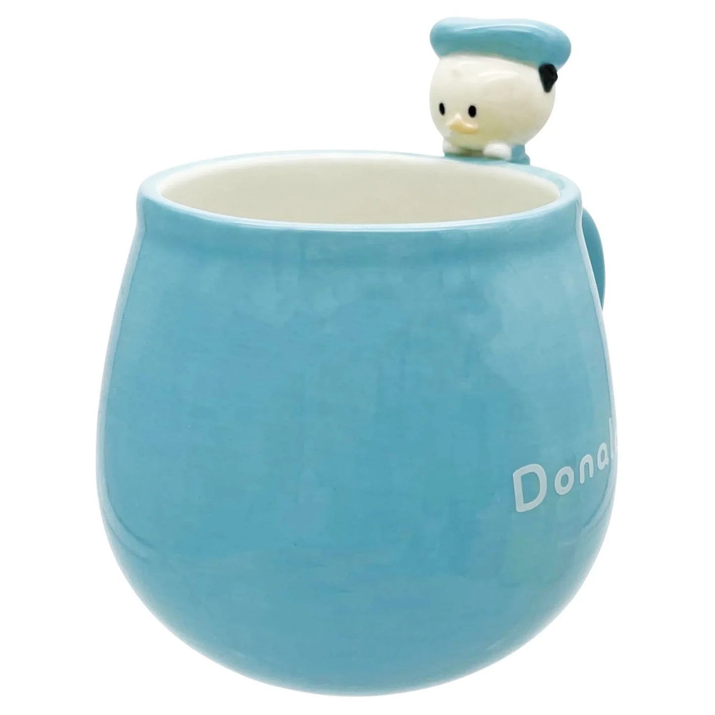 Blue mug with a small Disney Donald Duck on top and 'Donald' branding.
