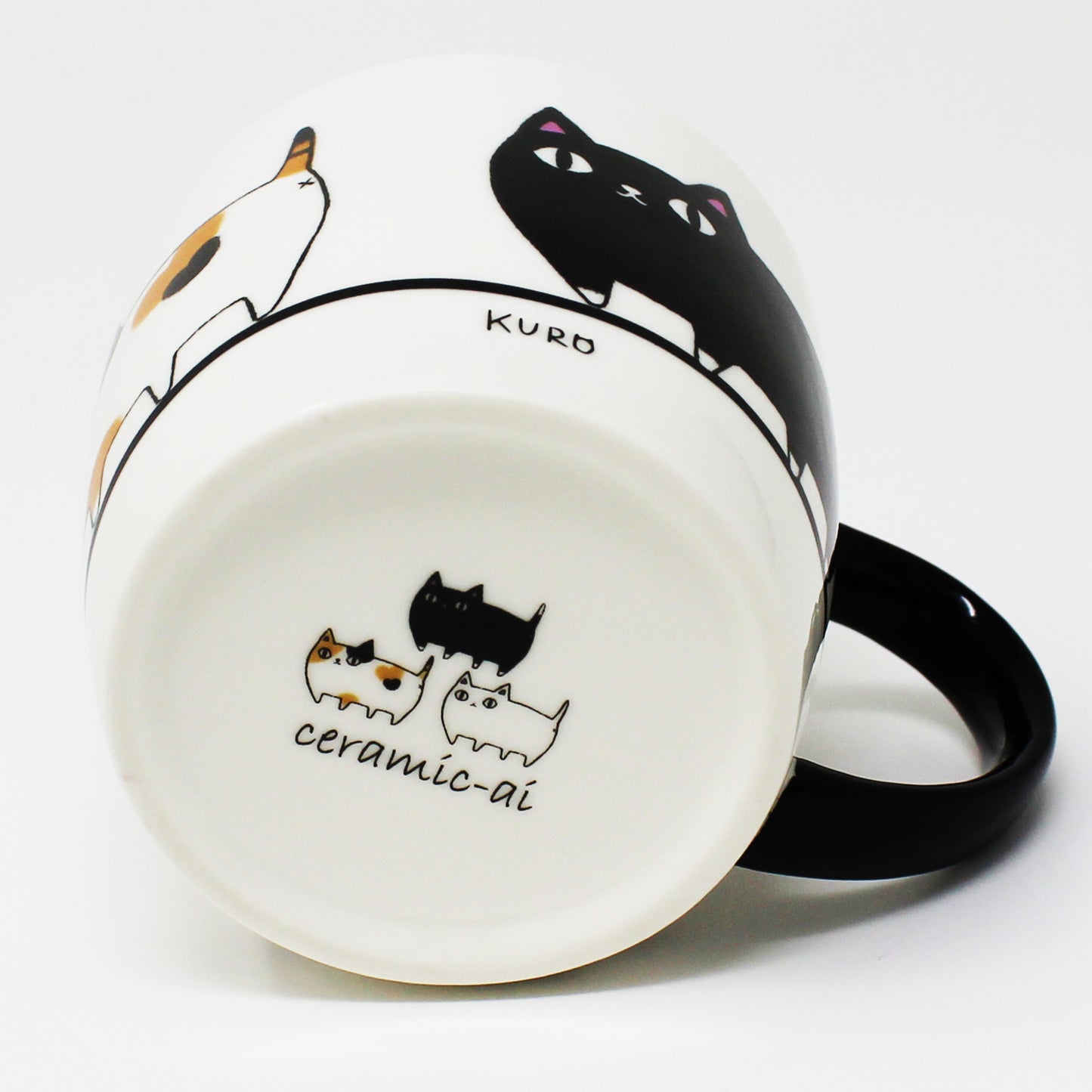 Bottom of mug showing the three cat brothers illustration – Japanese cat-themed design