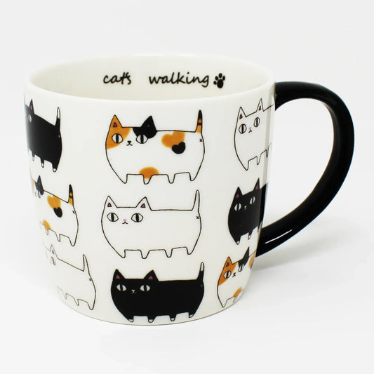 3 Cat Brothers Cat Parade Mug – White porcelain mug featuring Kuro, Shiro, and Mike marching around in a continuous pattern, with a black paw print inside and black handle – Nyan-ya Series from Japan