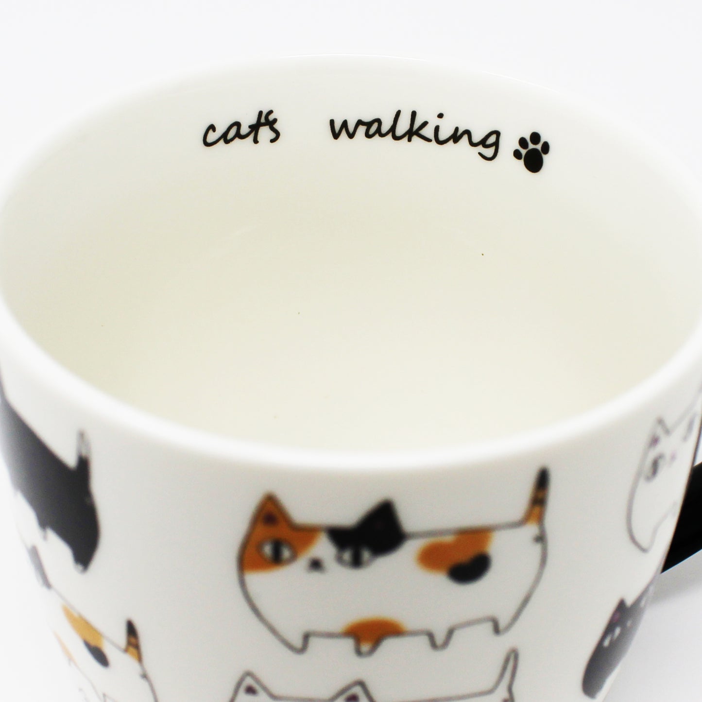 3 Cat Brothers Cat Parade Mug – White porcelain mug featuring Kuro, Shiro, and Mike marching around in a continuous pattern, with a black paw print inside and black handle – Nyan-ya Series from Japan