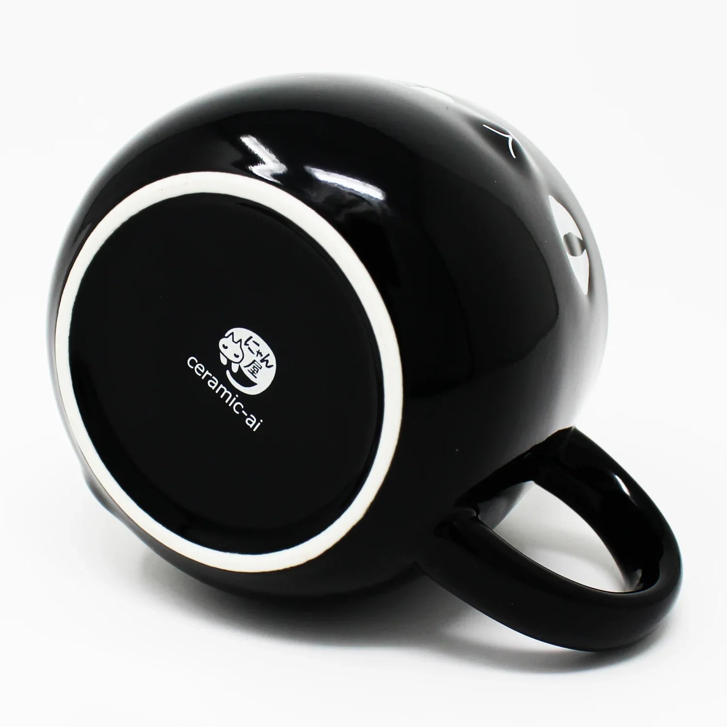 Bottom of Kuro Cat Mug featuring the Nyan-ya cat logo on porcelain base