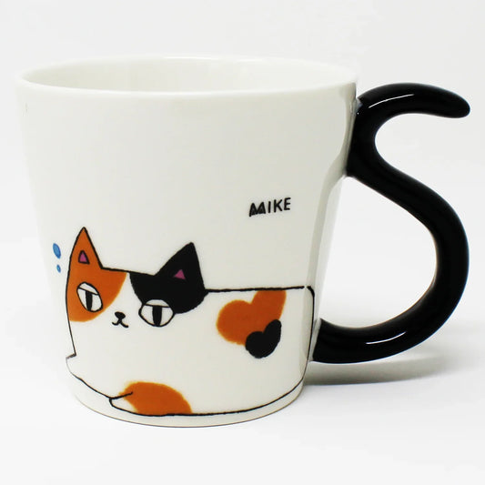 Porcelain mug featuring Mike the calico cat from the Nyan-ya series, shown laying down with a black tail-shaped handle, milk artwork, and a bottom graphic of all three cat brothers, in pink gift box.