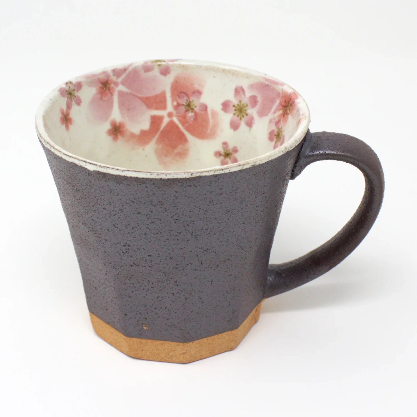 Gray Japanese Mino Ware mug with pink cherry blossom design, handcrafted and glazed, sitting next to its elegant gift box.