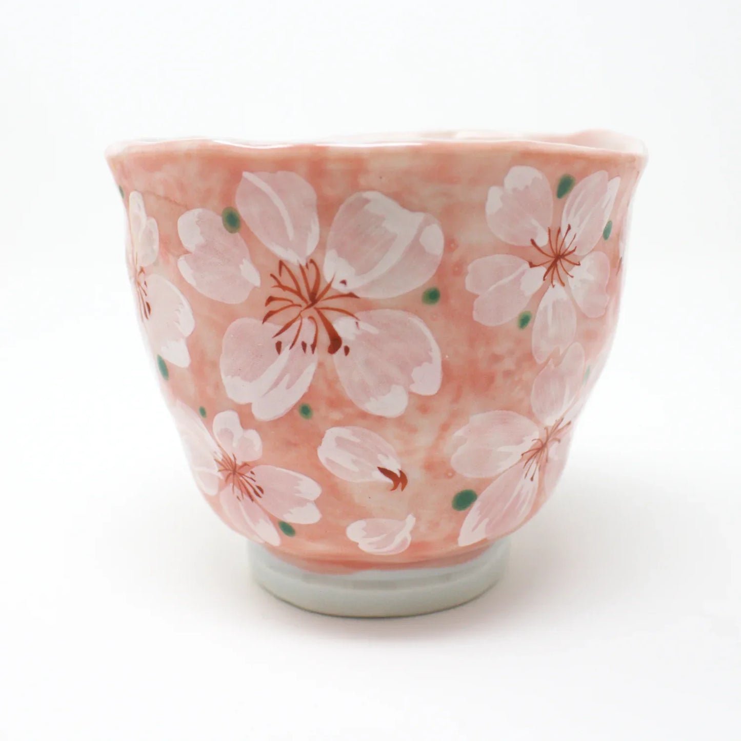 Side view of Yayoihana Mino Ware Yunomi Teacup in soft pink with white cherry blossom flowers, handcrafted in Japan