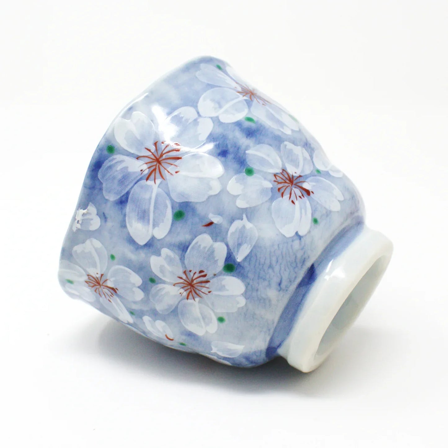 Yayoihana Mino Ware Yunomi Teacup – Blue Cherry Blossom Japanese Porcelain Cup, handcrafted in Japan, featuring a pale blue surface adorned with delicate white cherry blossom flowers, perfect for tea lovers and collectors of Japanese art.