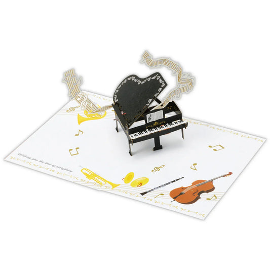 3D pop-up card with a piano and musical instruments on a white background