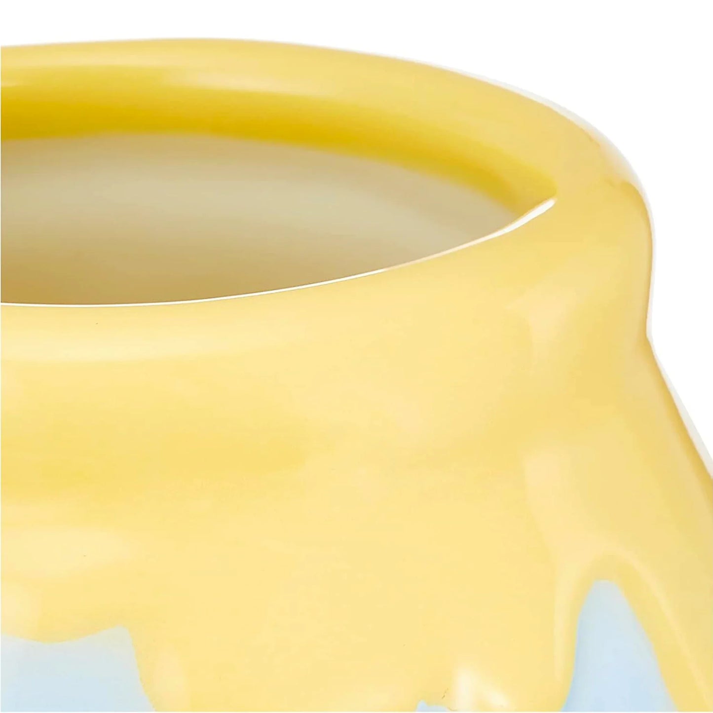 Close-up of a Winnie the Pooh yellow ceramic teacup