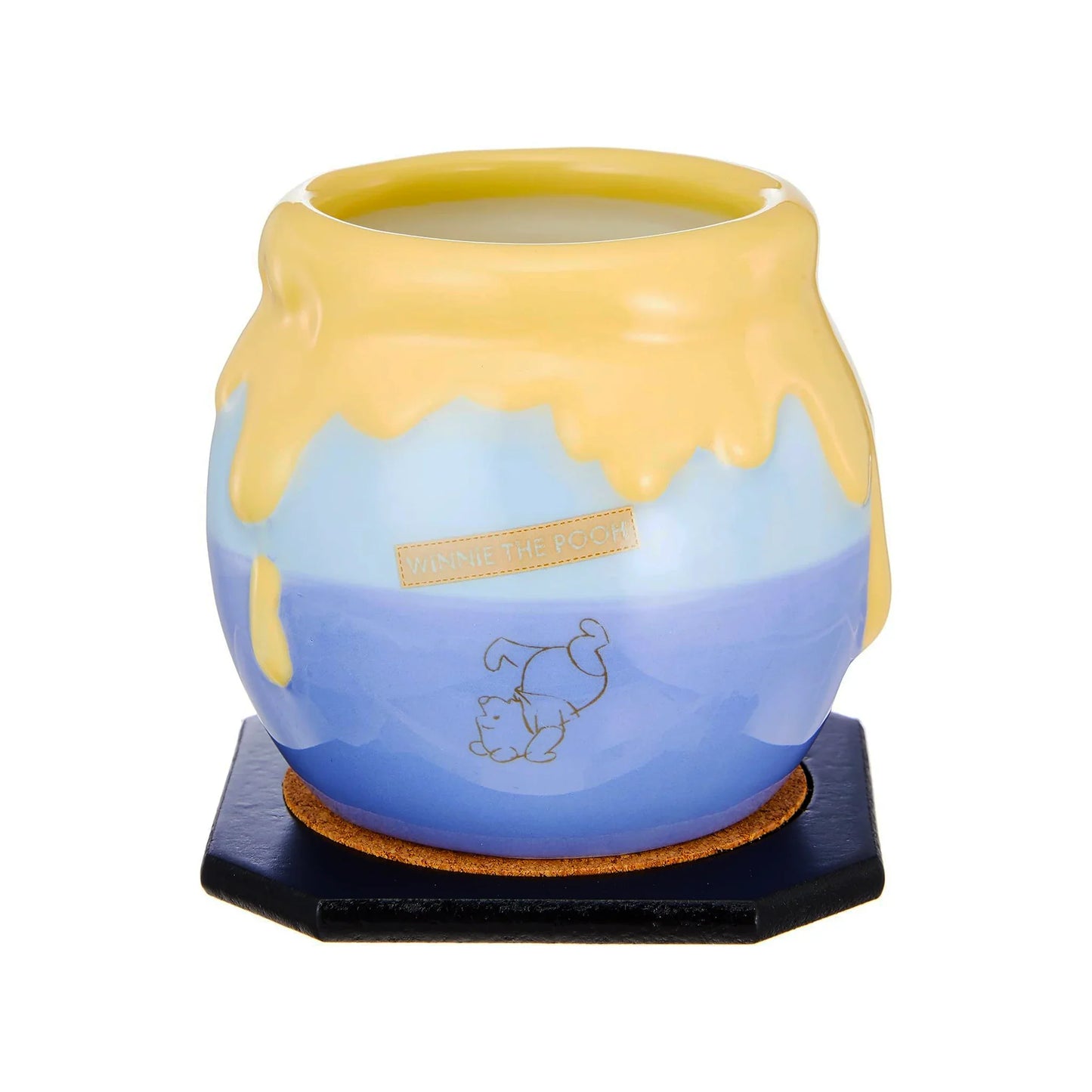 Ceramic mug with Disney Winnie the Pooh blue and yellow design on a white background