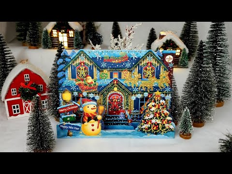 Video of a musical Christmas house pop-up card opening, playing six holiday songs and glowing with 59 LED lights