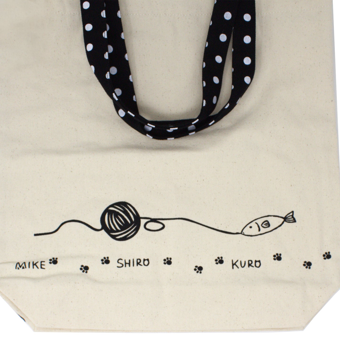 Back of canvas tote bag showing playful fish and yarn design from Nyan-ya series