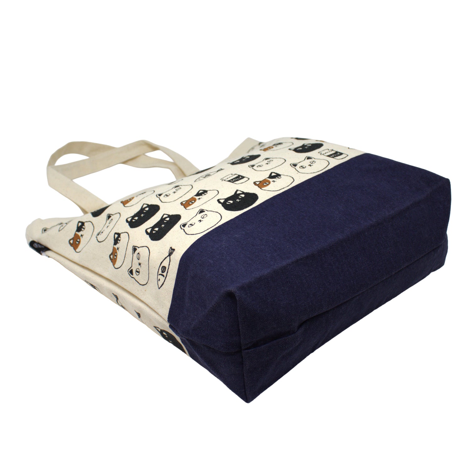 Canvas tote bag with cute cat faces of Shiro, Kuro, and Mike from the Nyan-ya series, featuring black polka dot handles and inner pocket – perfect for cat lovers.