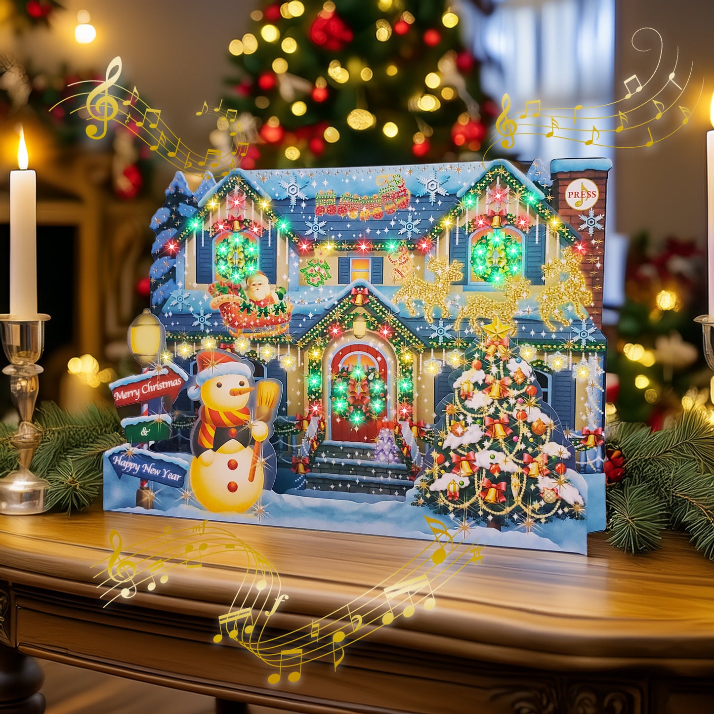 Decorative Christmas scene with a house, tree, and Christmas lights and musical card on a wooden surface with festive lights and decorations.