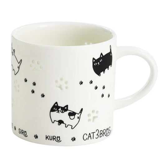 Openwork porcelain cat mug with marching 3 Cat Brothers design and paw-shaped cutout
