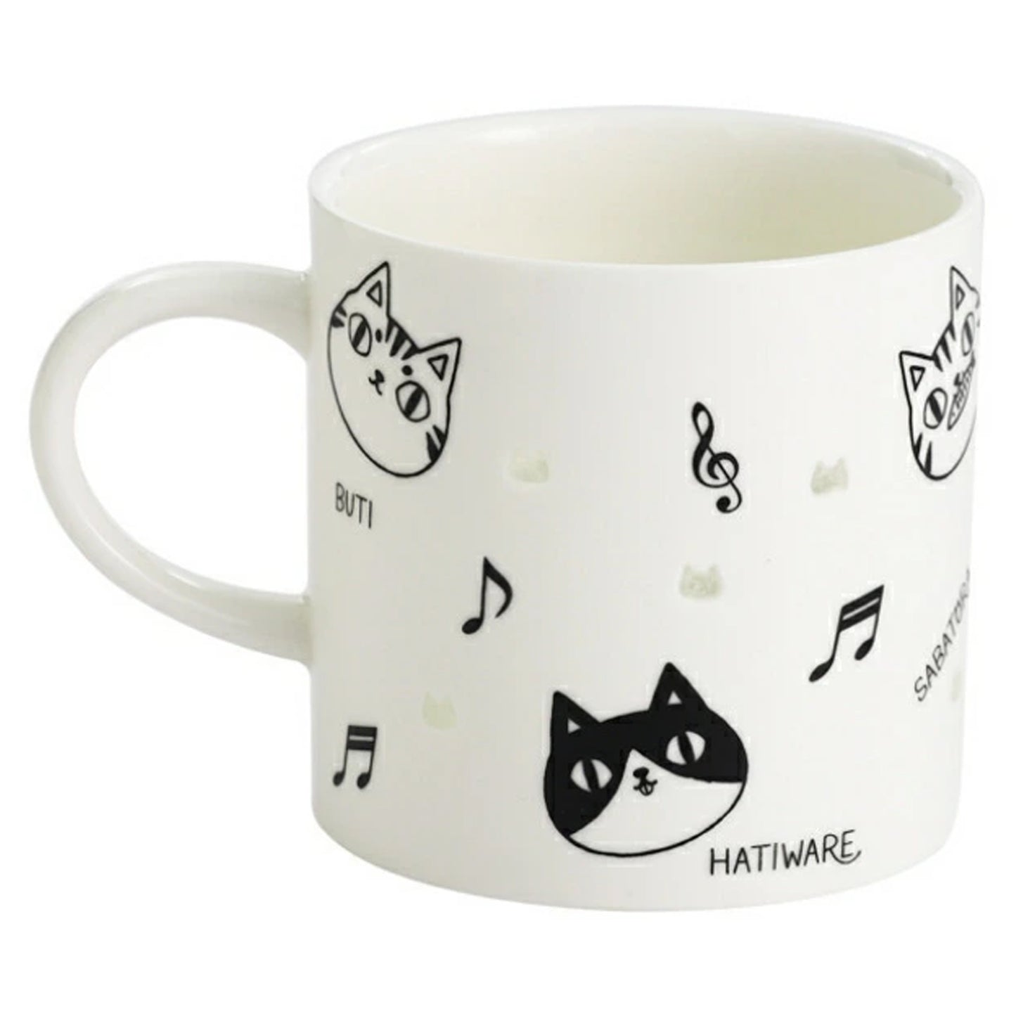 White mug with black cat and music note designs on a white background