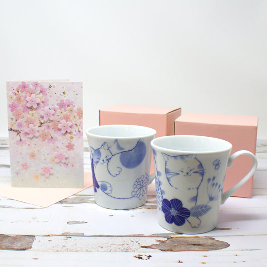Japanese Nohohon Cat Mug and Cherry Blossom Card Gift Set – Mugi (Walking Cat) or Sora (Laying Cat) – Porcelain mug with black cat design and elegant sakura greeting card, perfect for cat lovers or Mother’s Day gift.