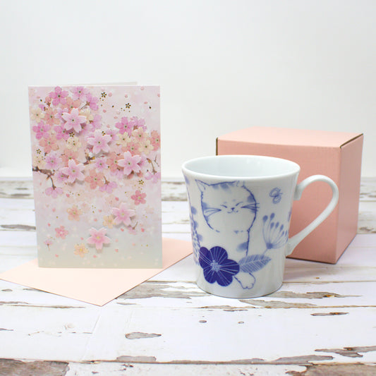 Japanese Nohohon Cat Mug and Cherry Blossom Card Gift Set – Mugi (Walking Cat) or Sora (Laying Cat) – Porcelain mug with black cat design and elegant sakura greeting card, perfect for cat lovers or Mother’s Day gift.