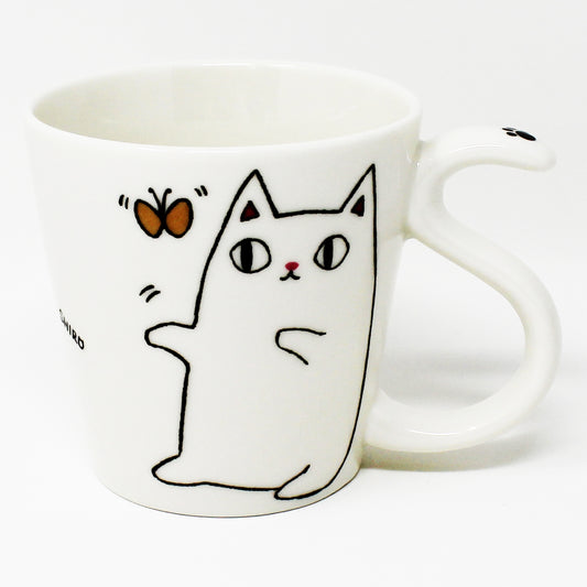 Front of white porcelain mug with Shiro the cat playfully reaching for a butterfly; part of the Nyan-ya series.