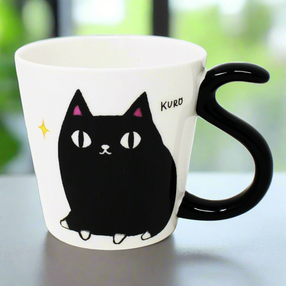 Front view of Kuro the black cat porcelain mug with tail-shaped handle – Nyan-ya Series from Japan
