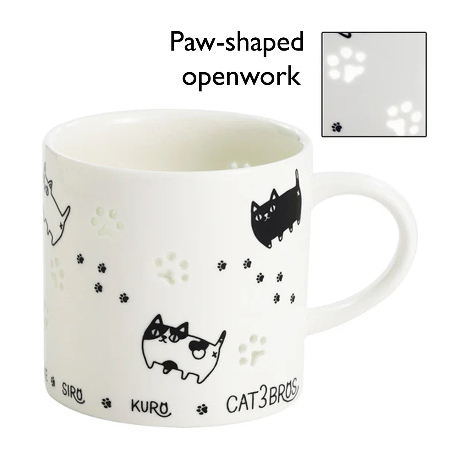 White mug with black cat illustrations and paw-shaped openwork on a white background