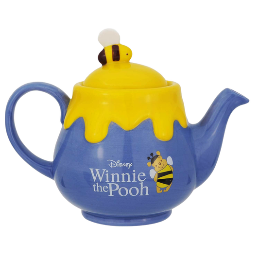 Purple teapot with yellow lid featuring a bee design and Disney 'Winnie the Pooh' branding on a white background.