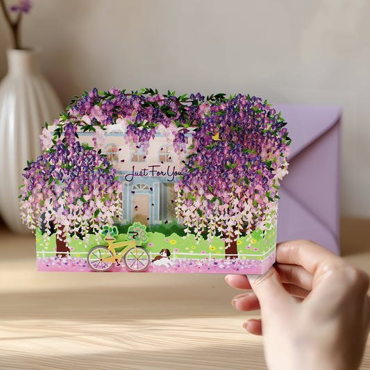 Wisteria pop up greeting card shown in hand with matching light purple envelope
